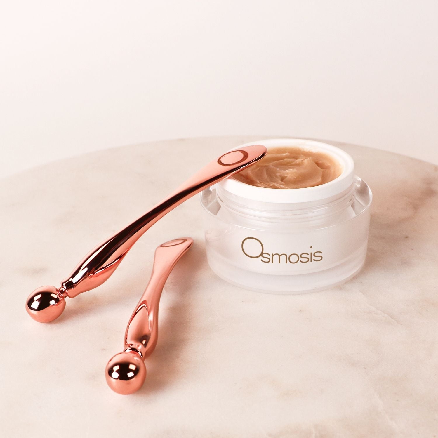 two mini multi tools displayed next to osmosis beauty jar skincare