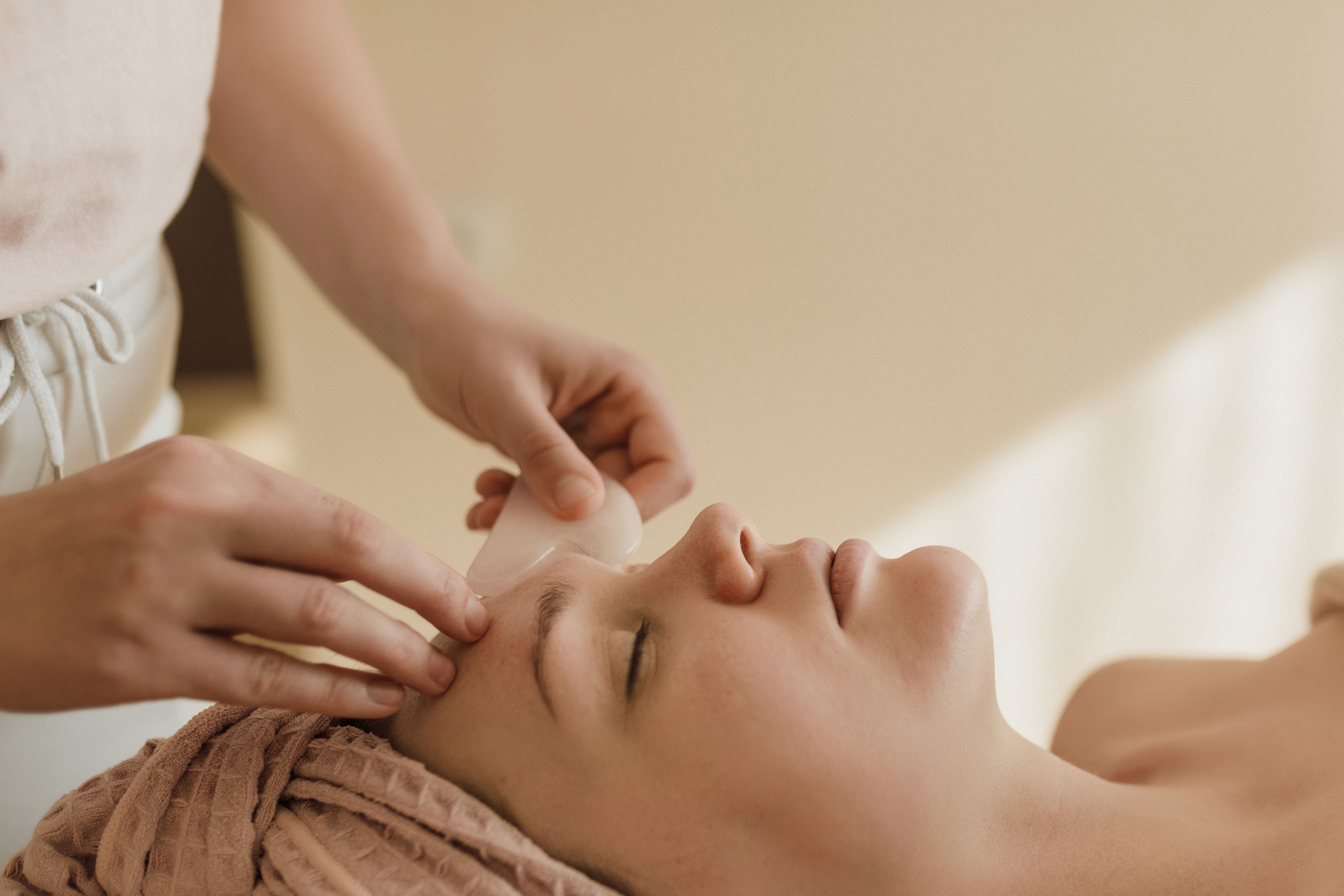Person receiving a facial treatment with a focus on skincare.
